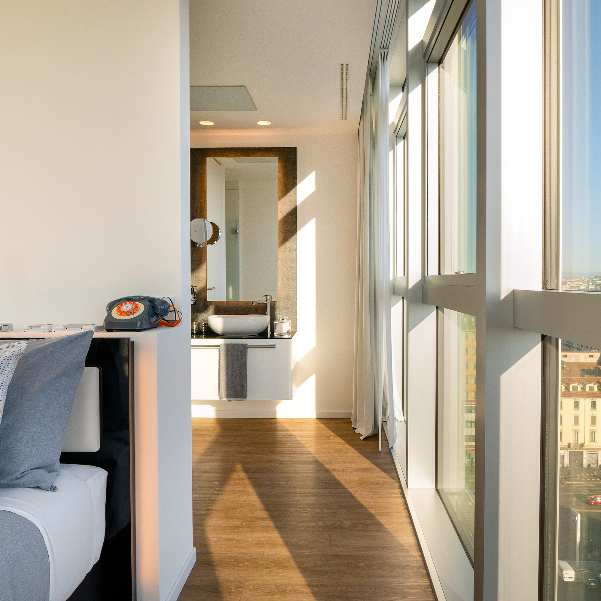 a room with a window and a wood floor