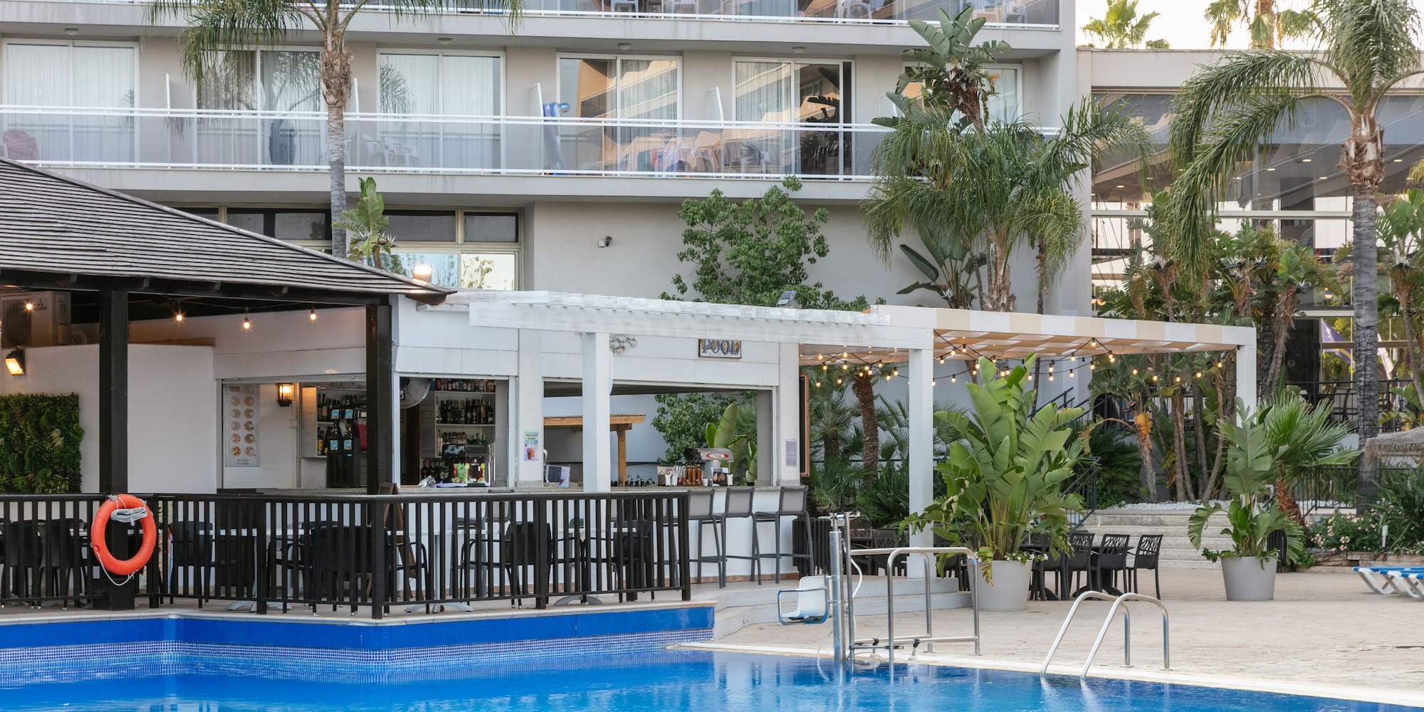 a swimming pool in front of a building