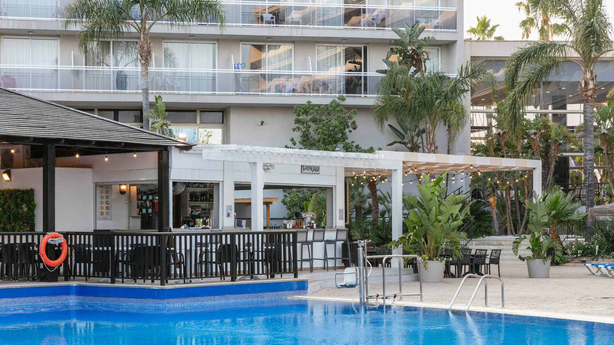 a swimming pool in front of a building