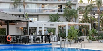 a swimming pool in front of a building
