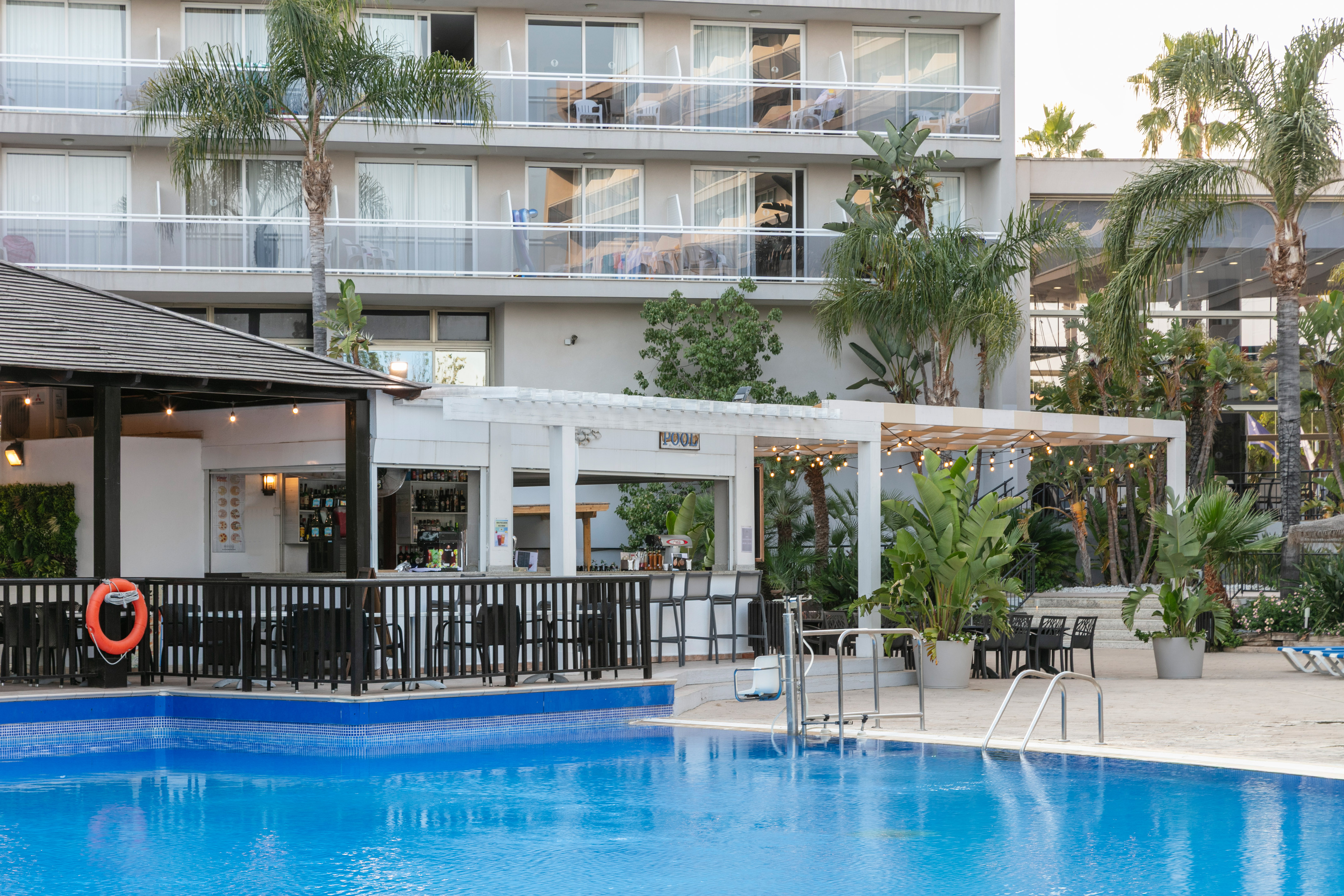 a swimming pool in front of a building