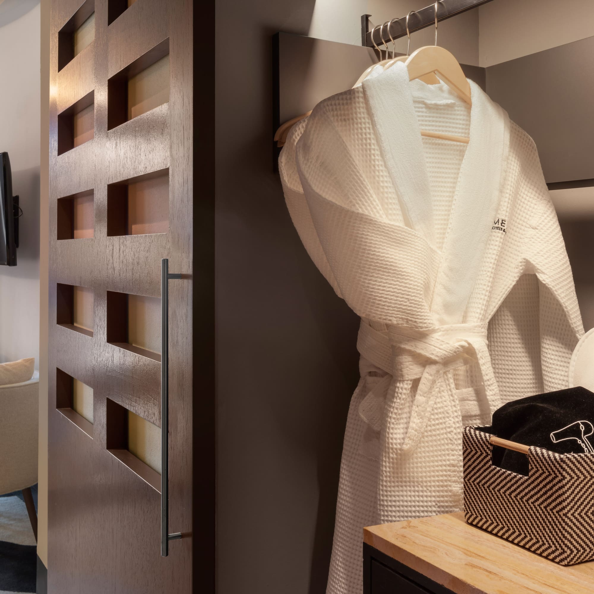 a white robe on a swinger in a room