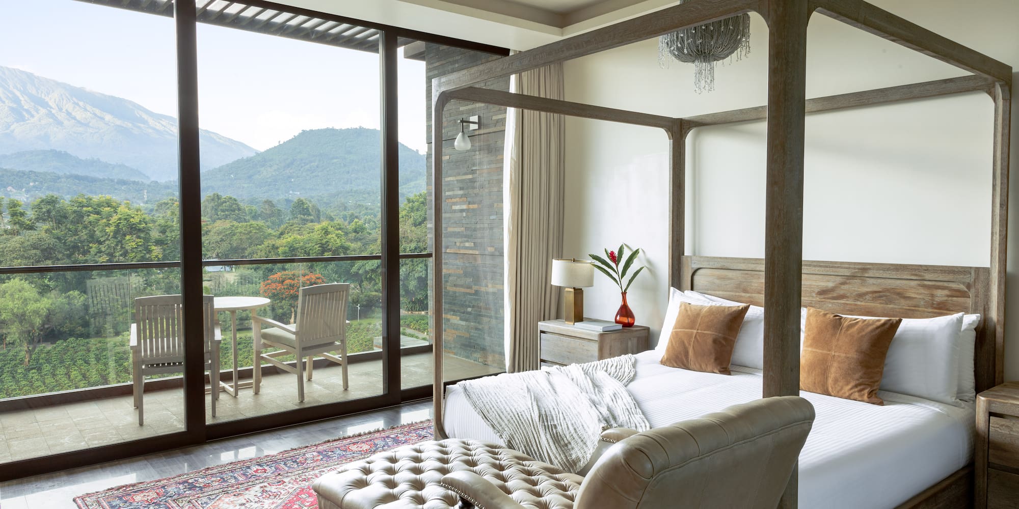 a bedroom with a bed and a chair