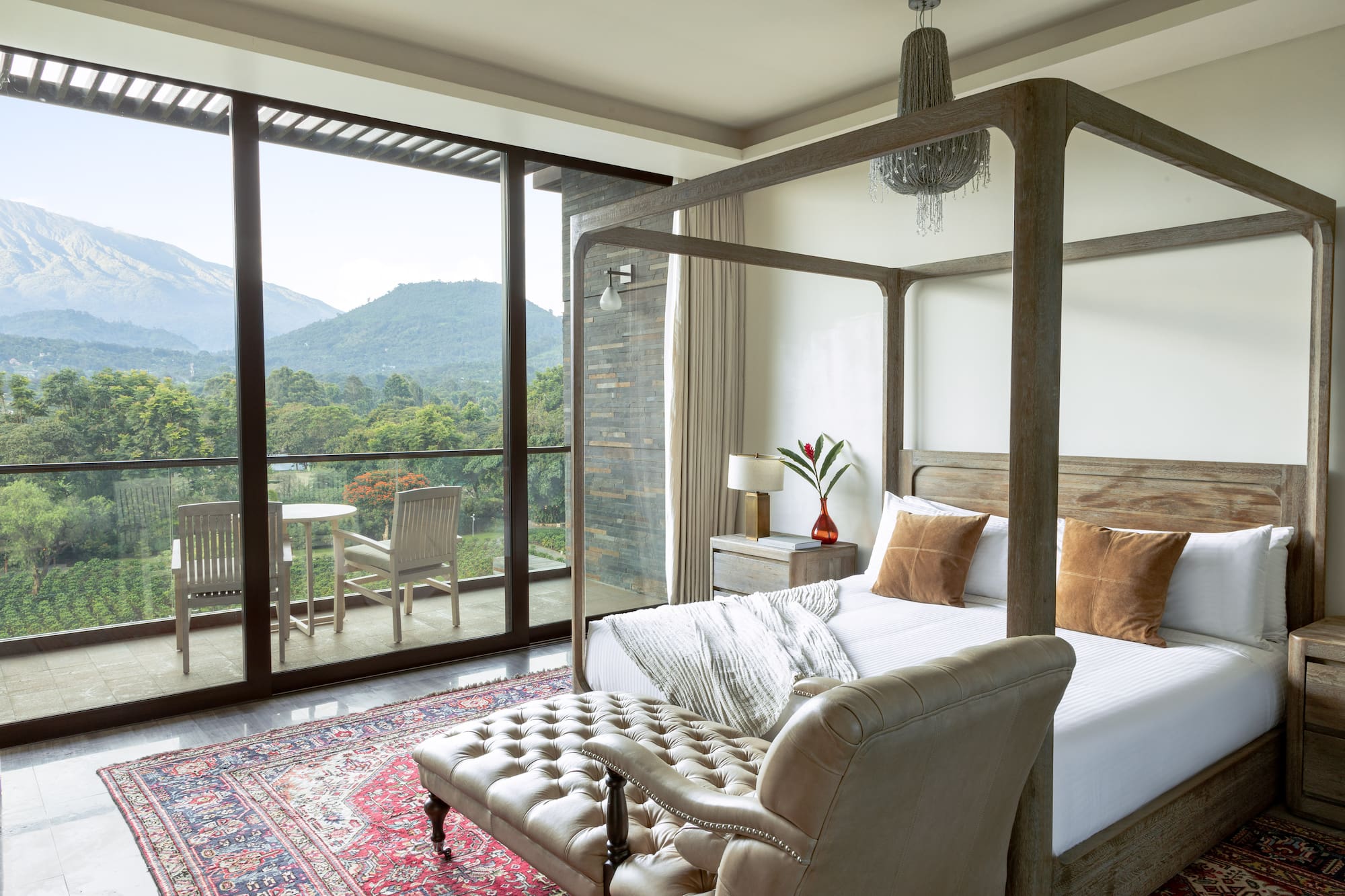 a bedroom with a bed and a chair