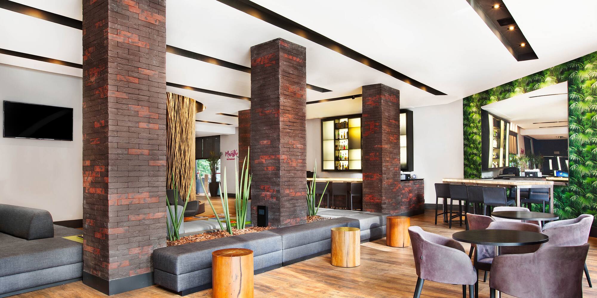 a room with a couch and chairs