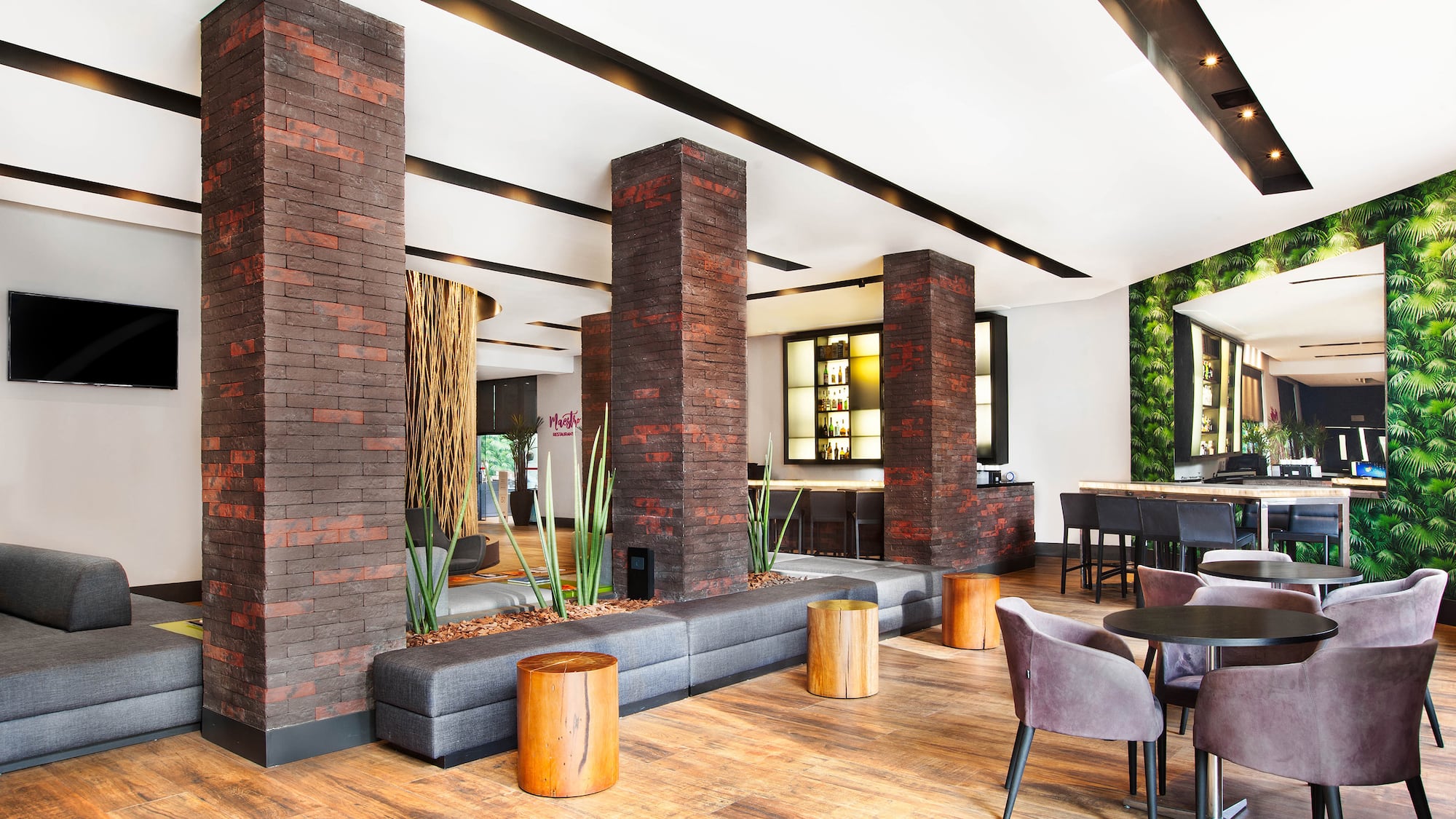 a room with a couch and chairs