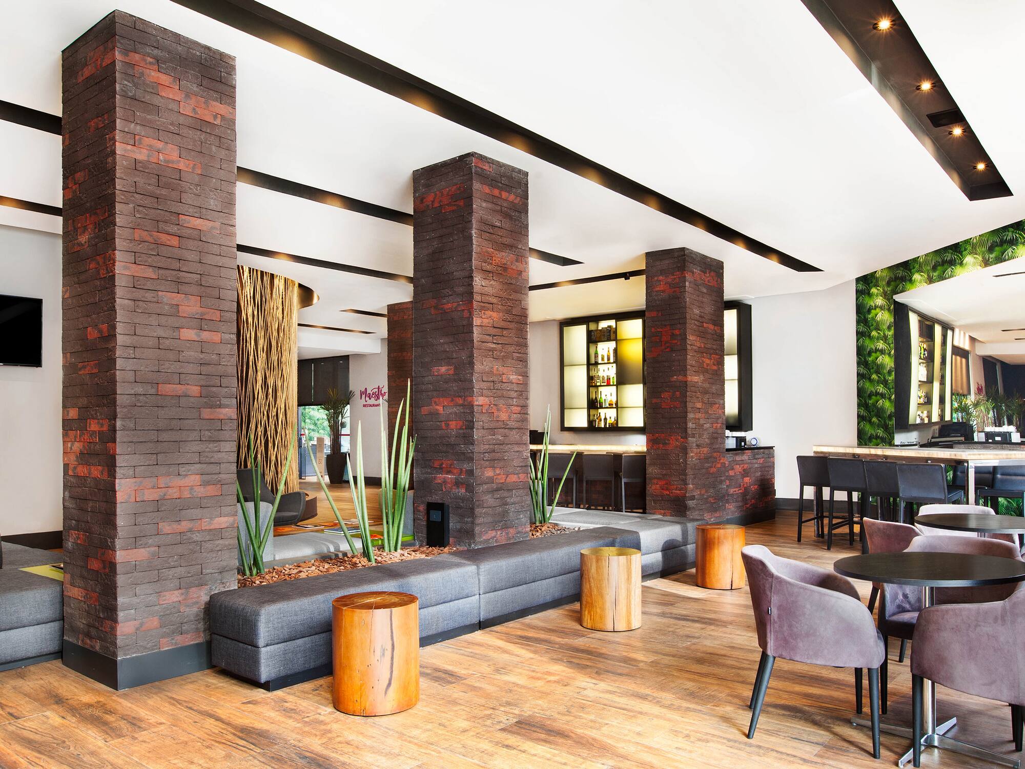 a room with a couch and chairs