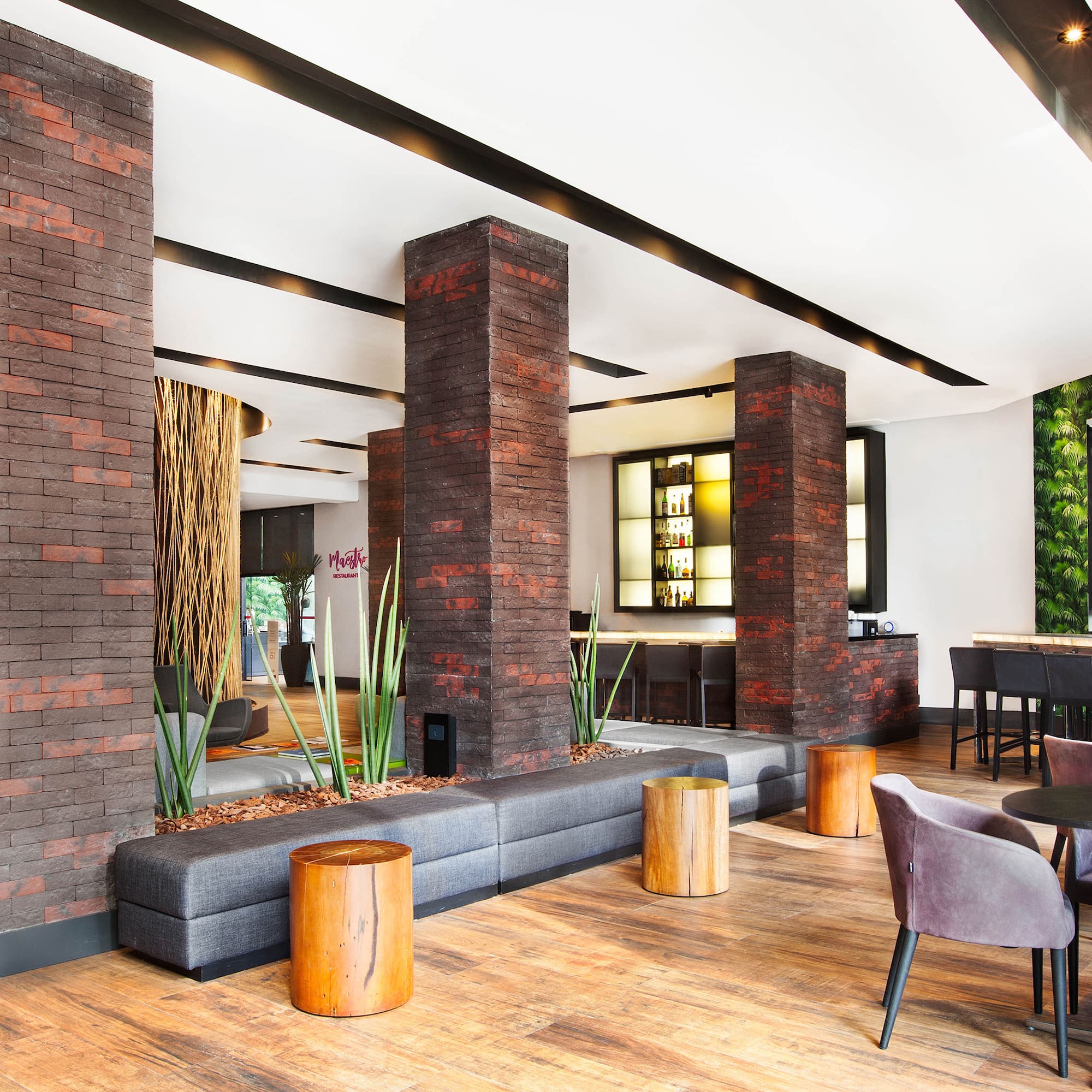 a room with a couch and chairs