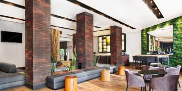 a room with a couch and chairs