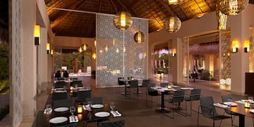 a restaurant with tables and chairs