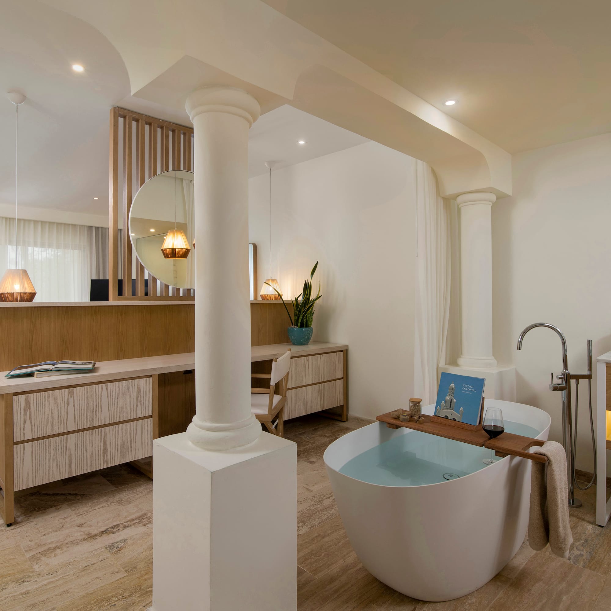 a bathroom with a tub and a sink