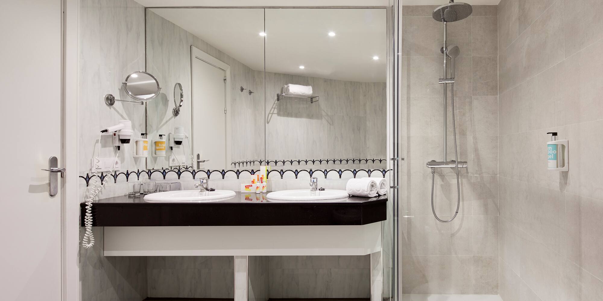 a bathroom with a shower and sink