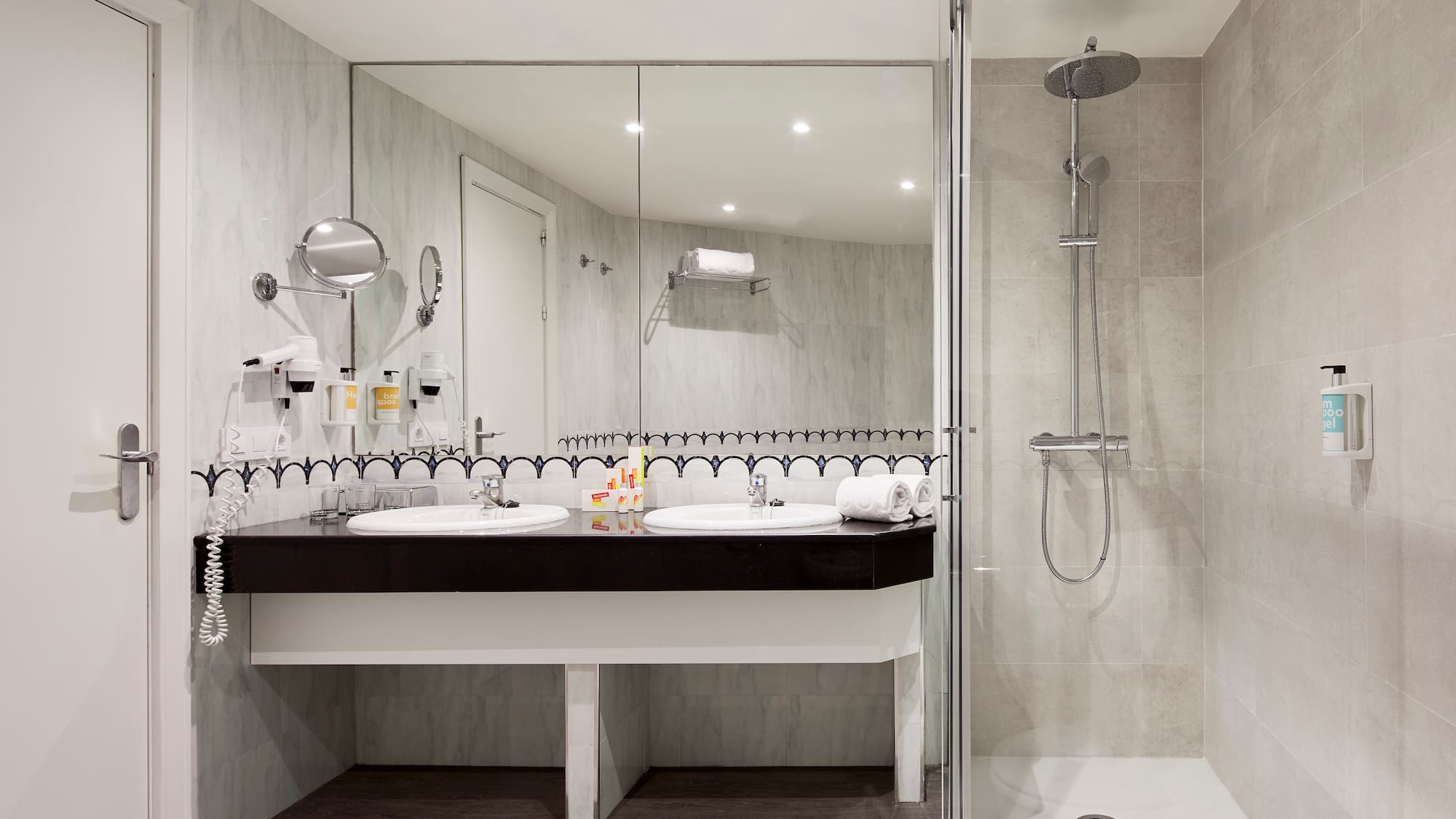 a bathroom with a shower and sink