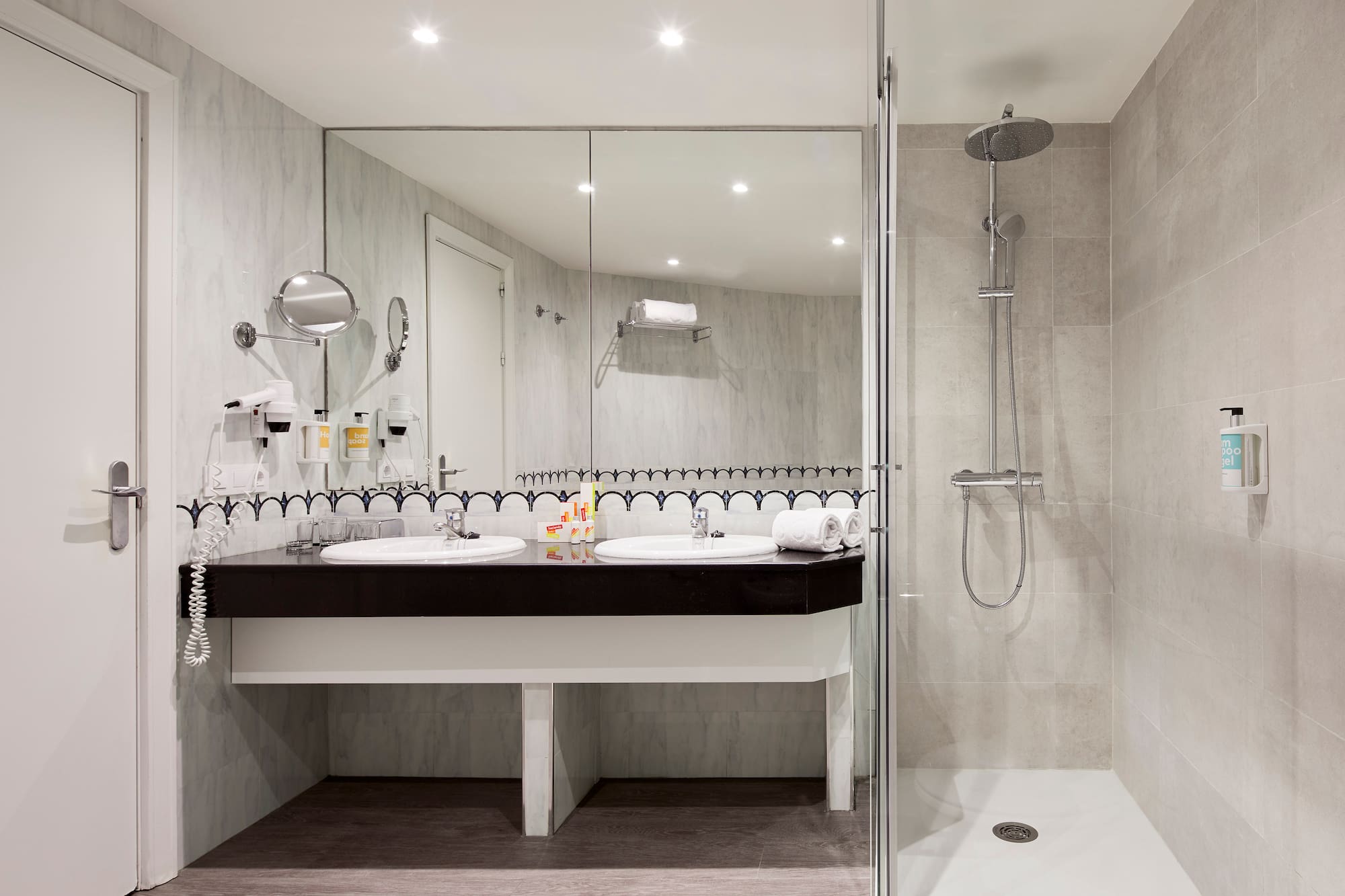 a bathroom with a shower and sink