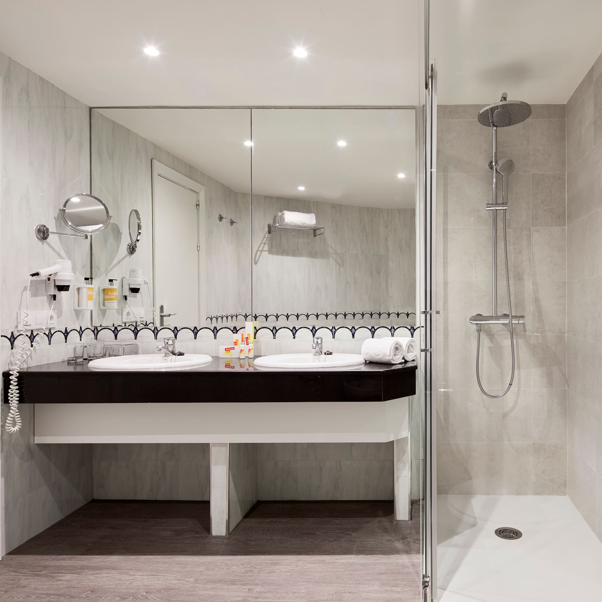 a bathroom with a shower and sink