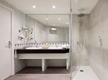 a bathroom with a shower and sink