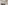 Contemporary hotel bathroom with double vanity, large mirror, and glass shower.