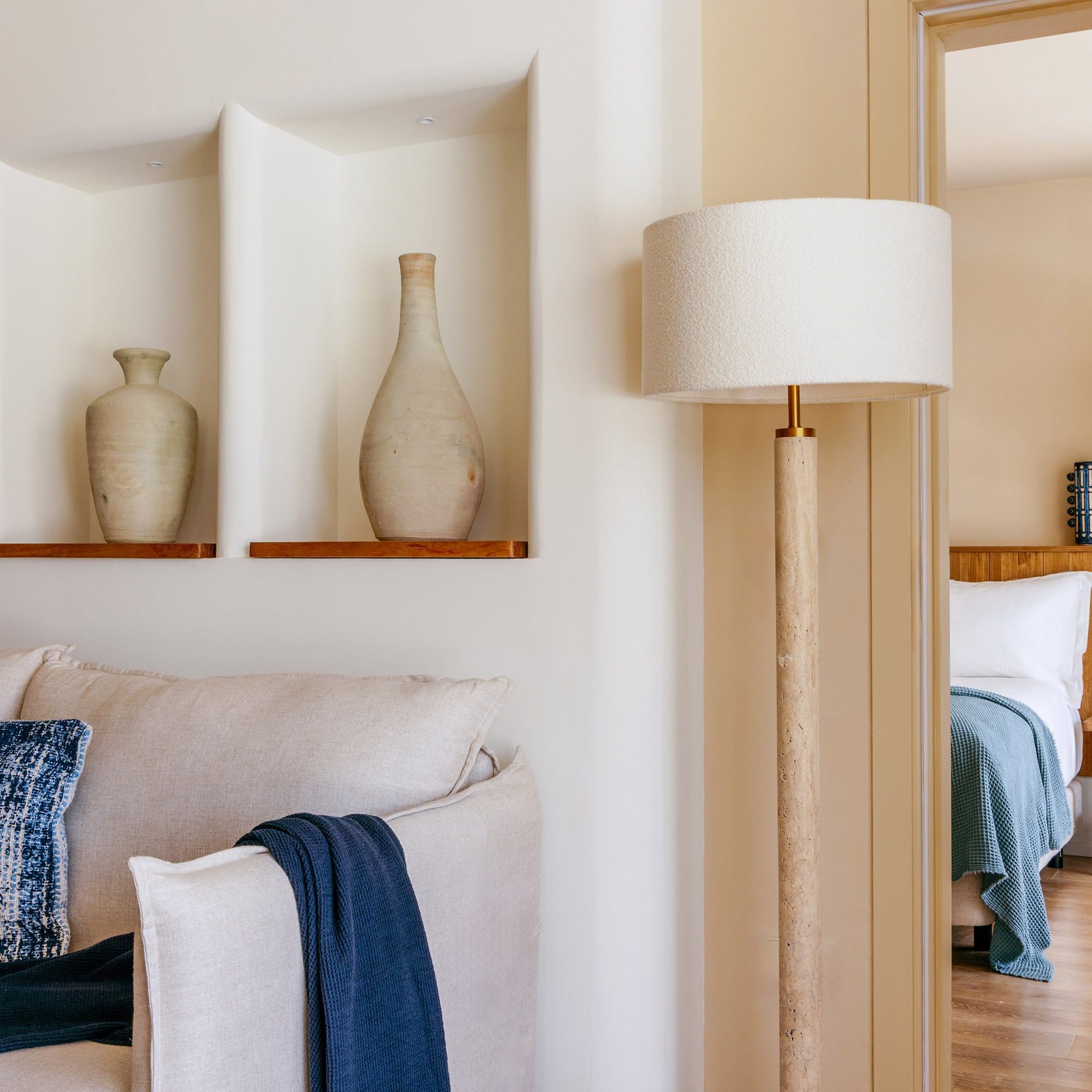 a lamp next to a couch