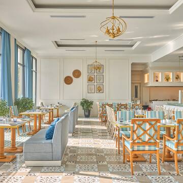 a room with tables and chairs