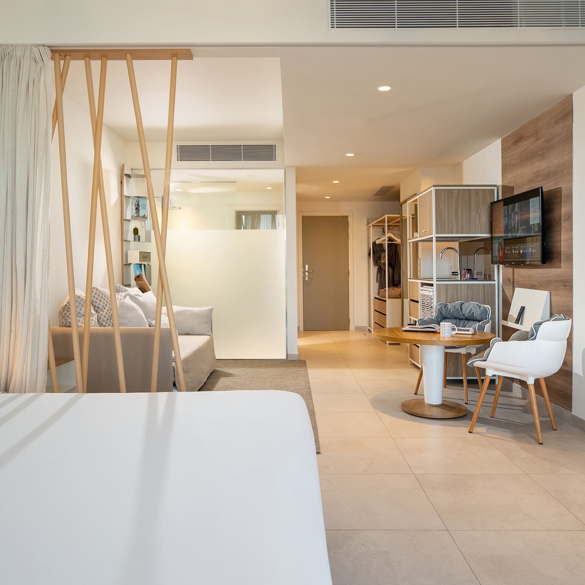 a room with a bed and a desk