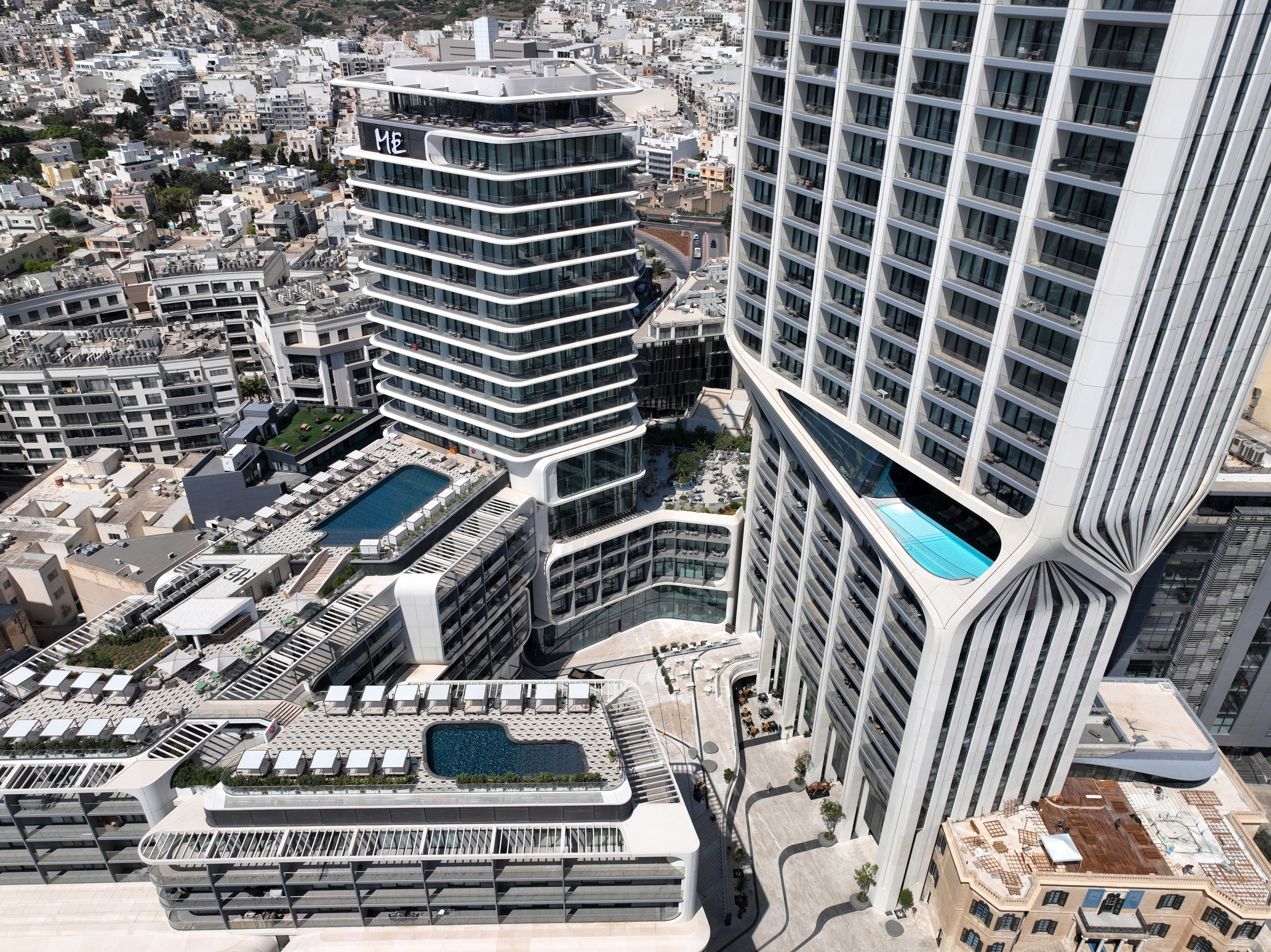 a group of buildings with a pool in the middle
