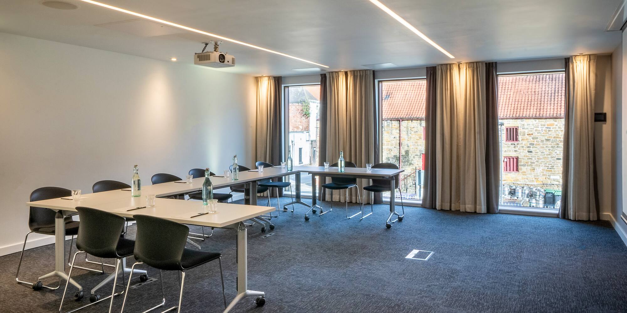 a room with tables and chairs