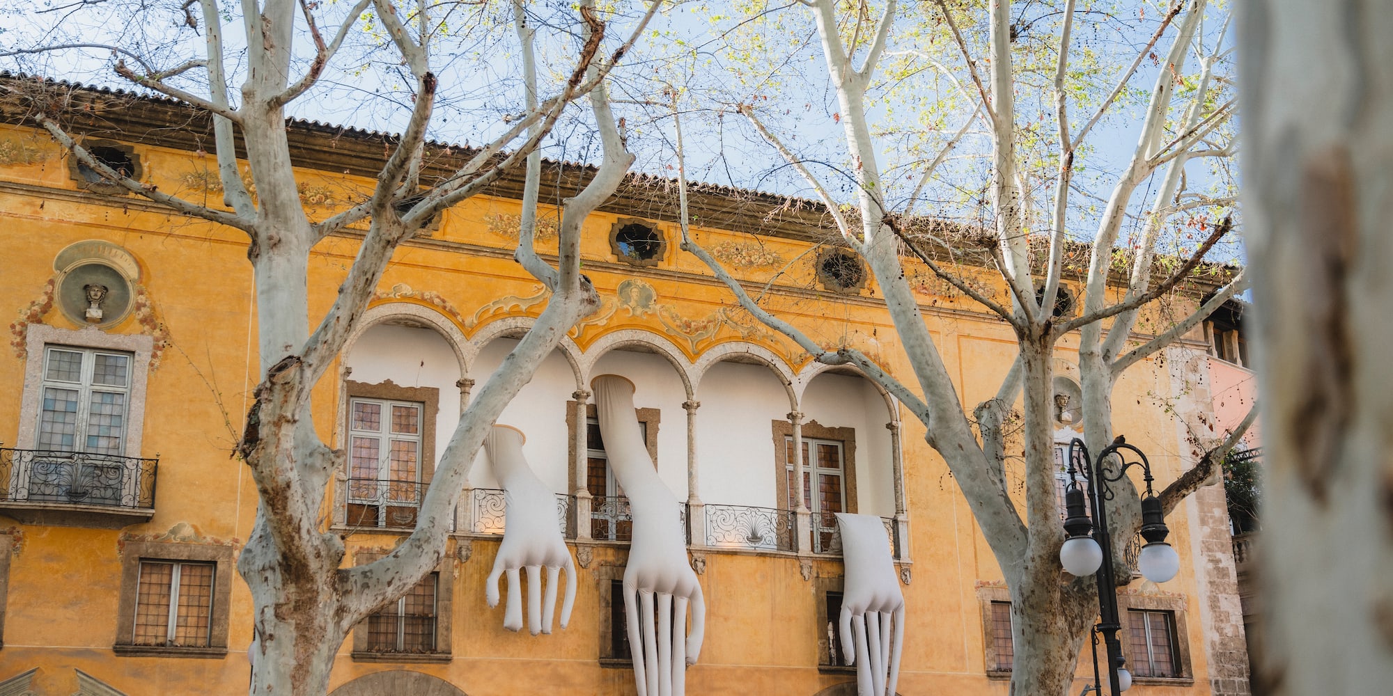 a building with white hands from the window