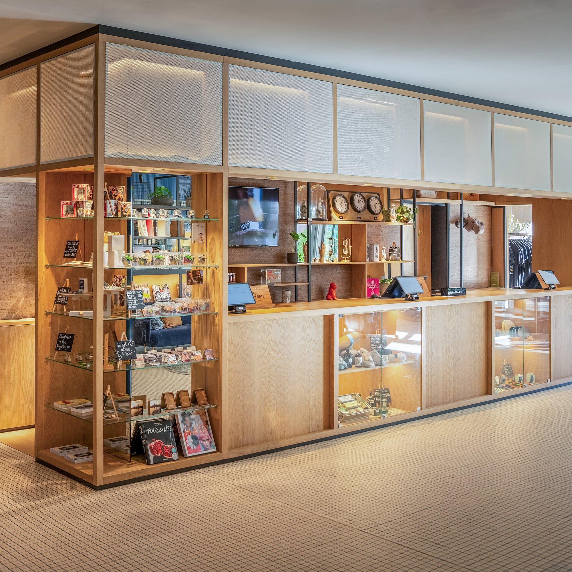 a display case with shelves and a television on it