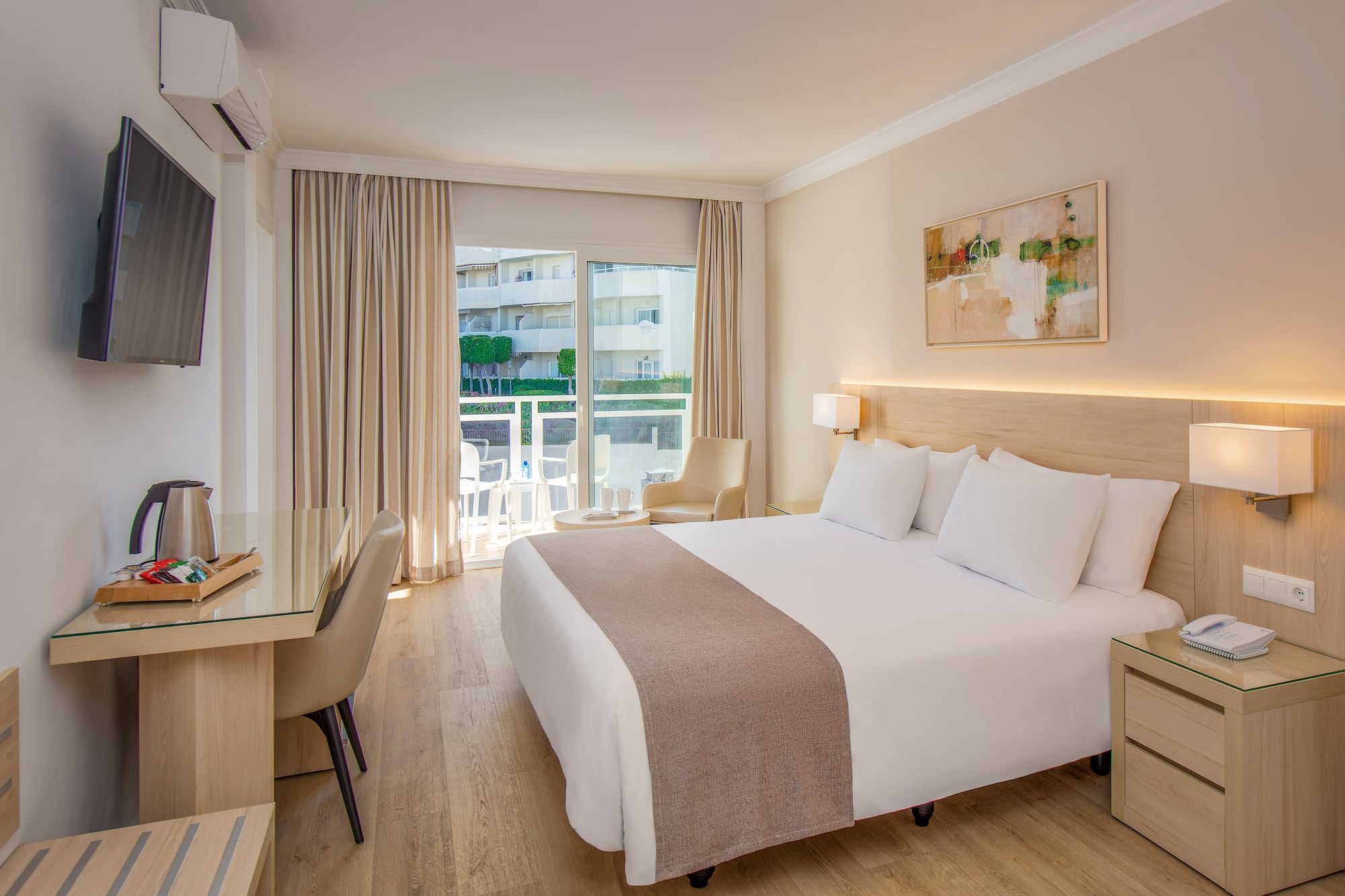 a room with a bed and a desk