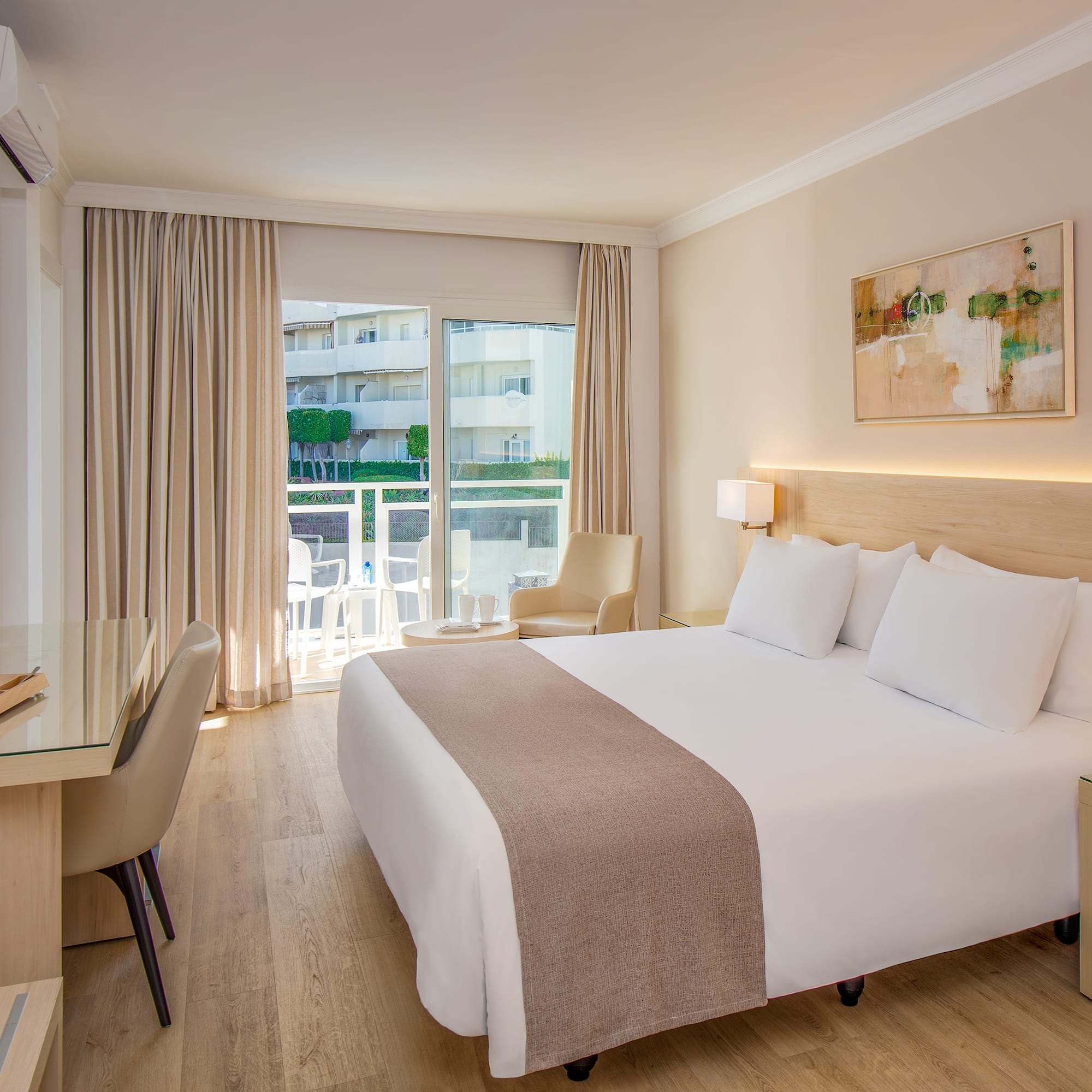 a room with a bed and a desk