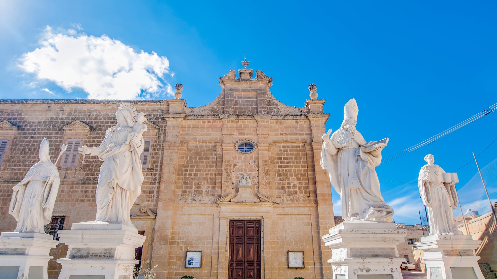 statues outside of a building