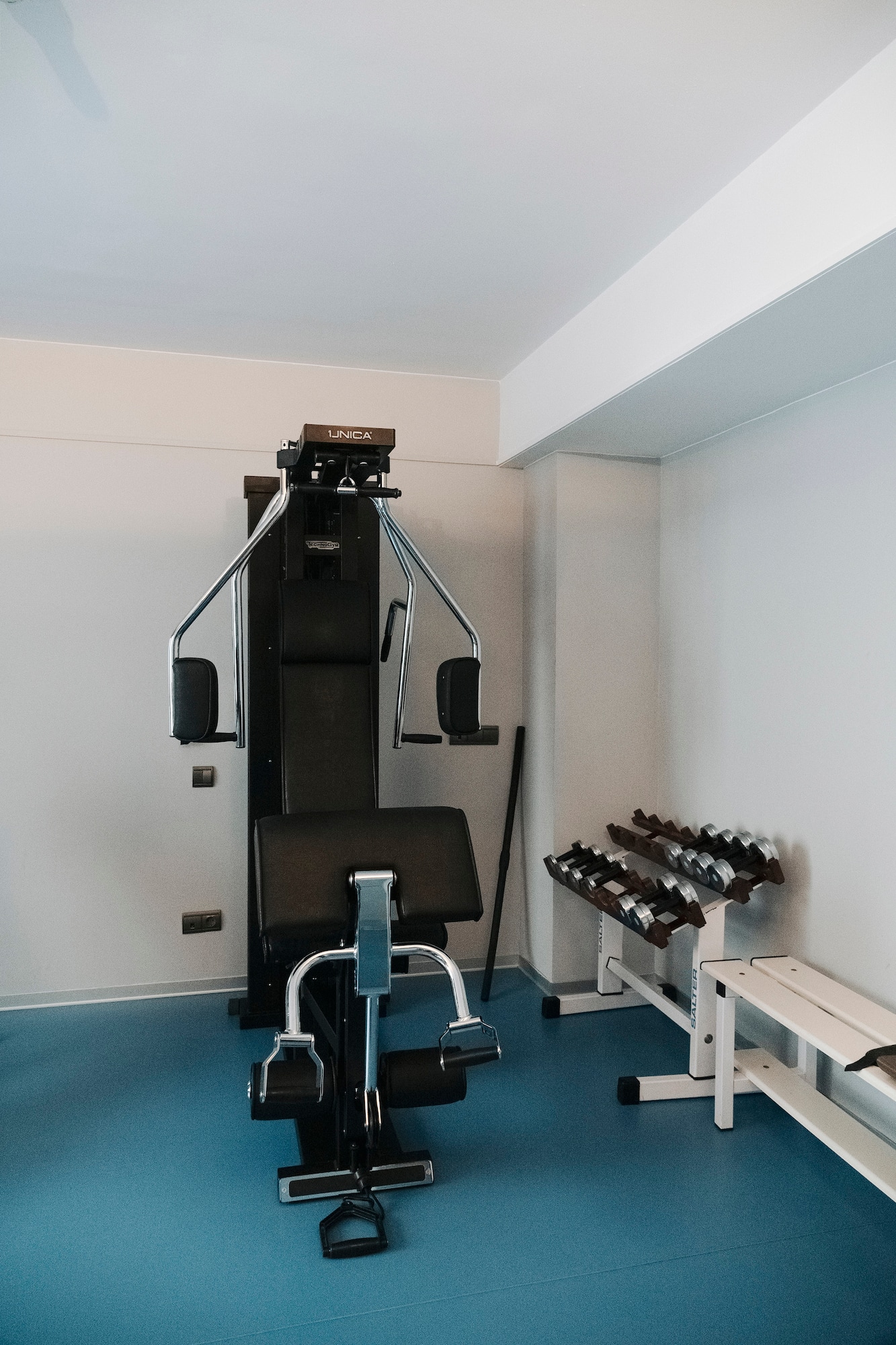 a gym with weights and equipment