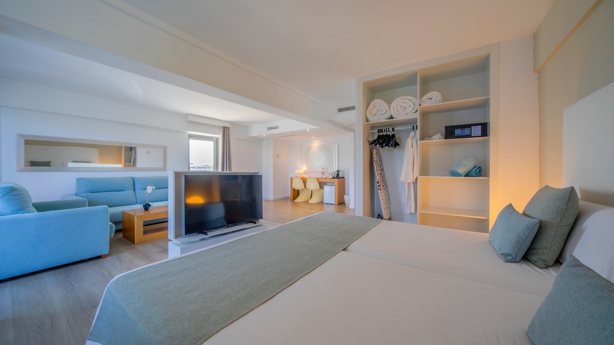 a room with a bed and a tv