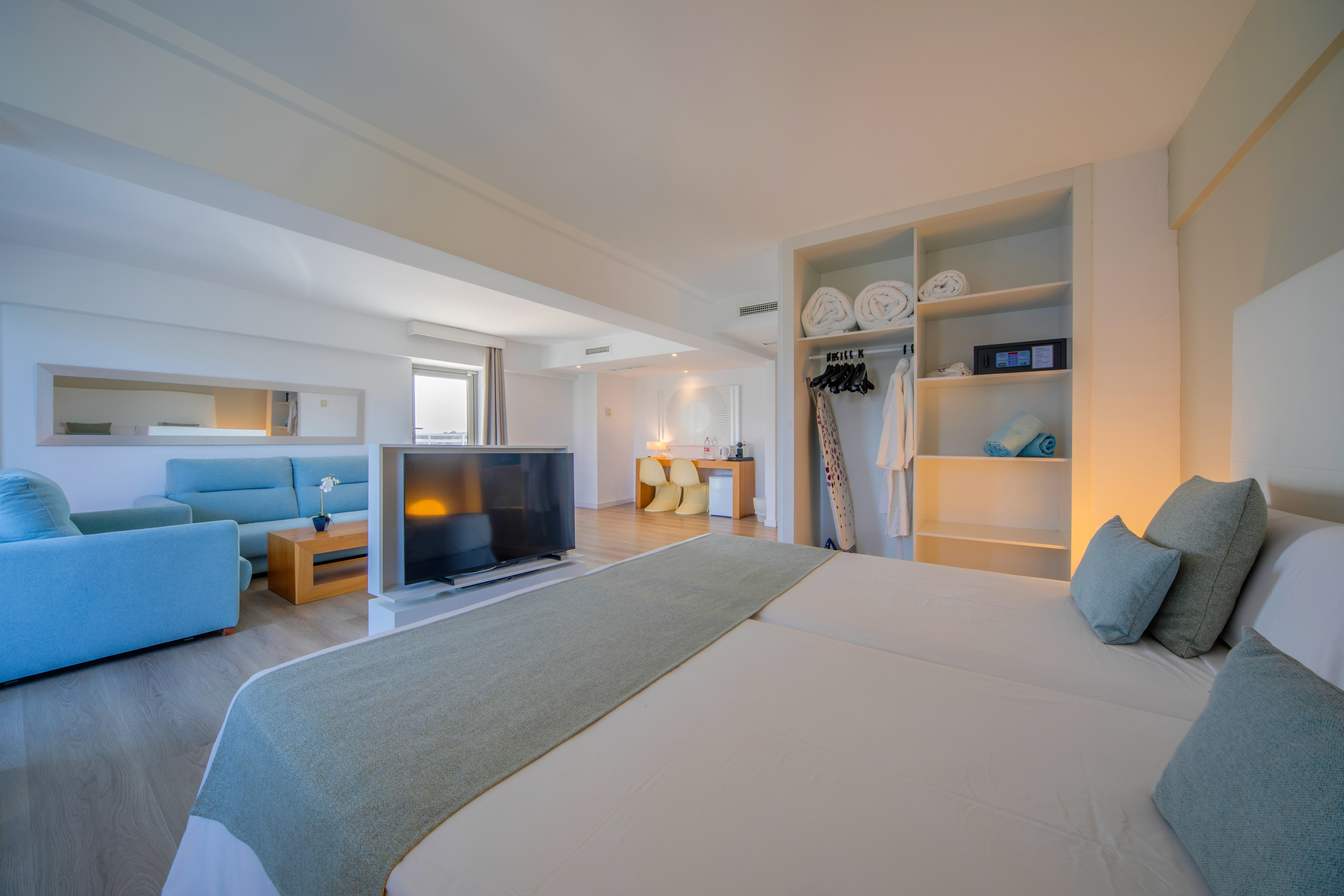 a room with a bed and a tv