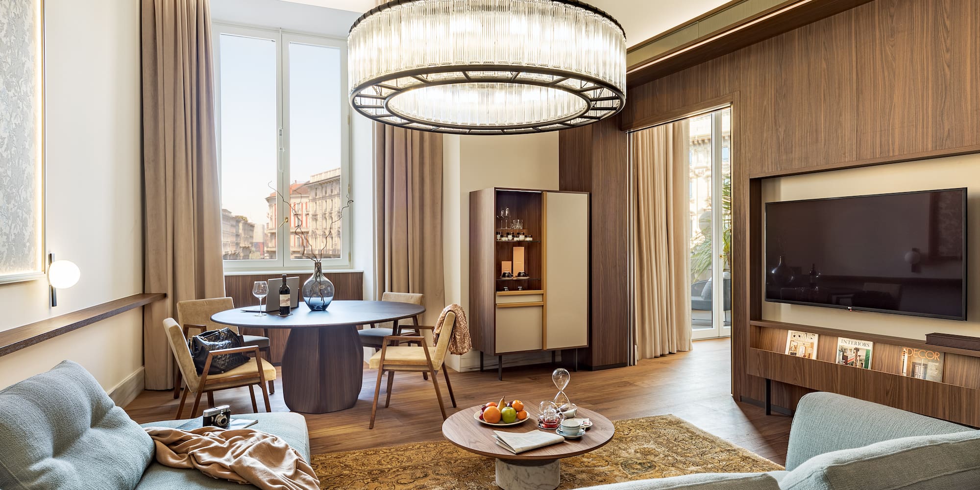 a living room with a large chandelier and a couch