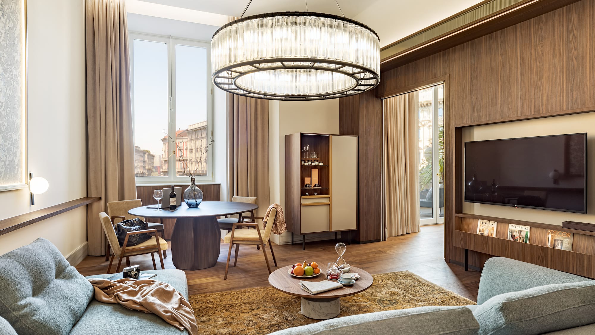 a living room with a large chandelier and a couch
