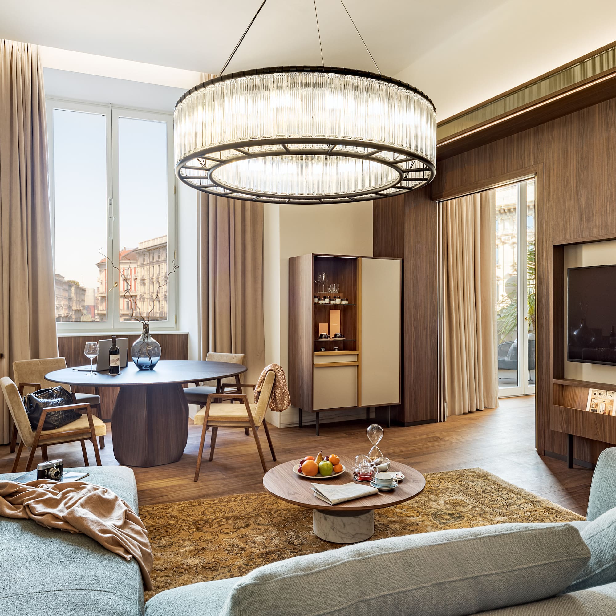 a living room with a large chandelier and a couch