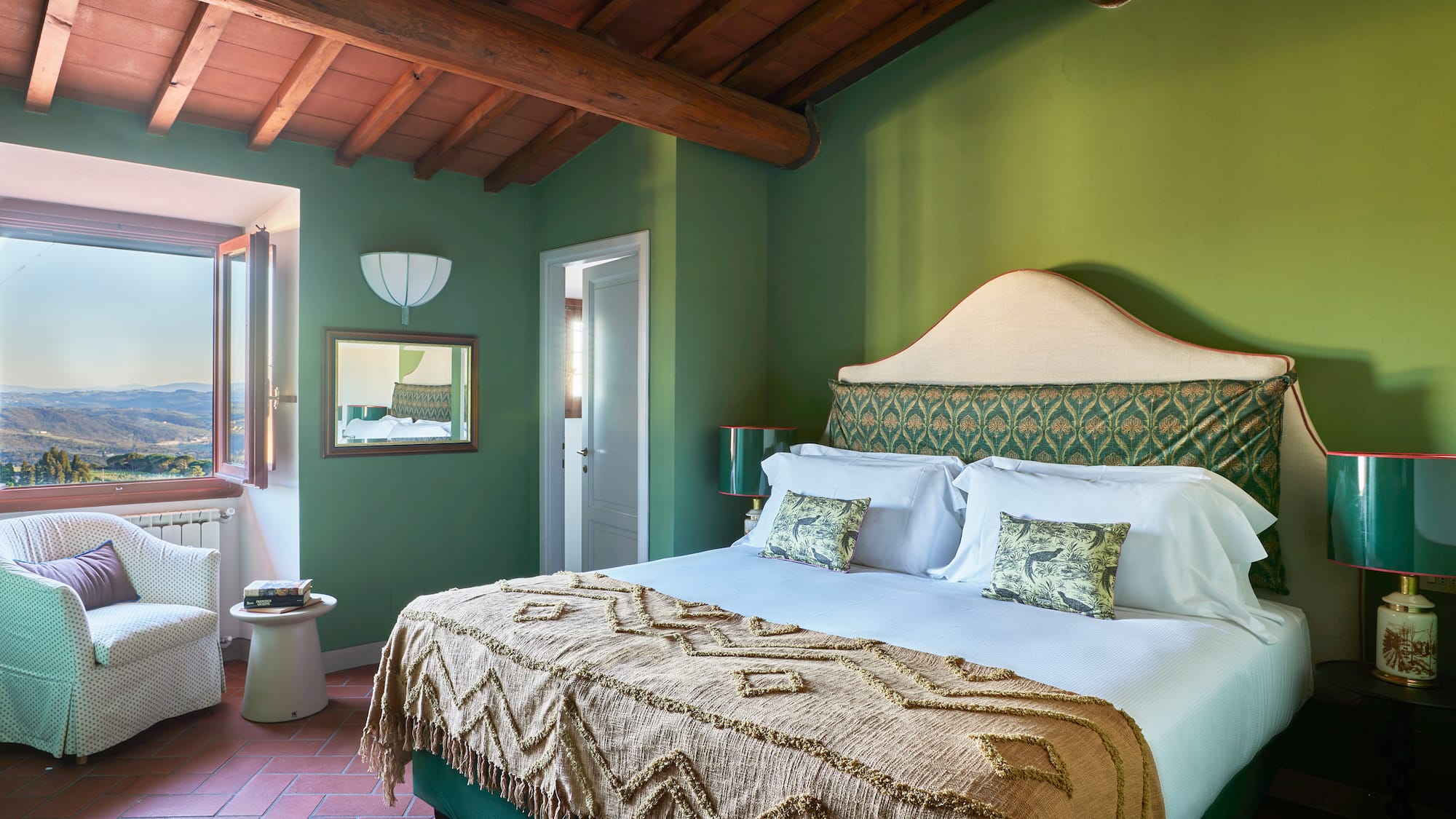 a green bedroom with a bed and a green wall