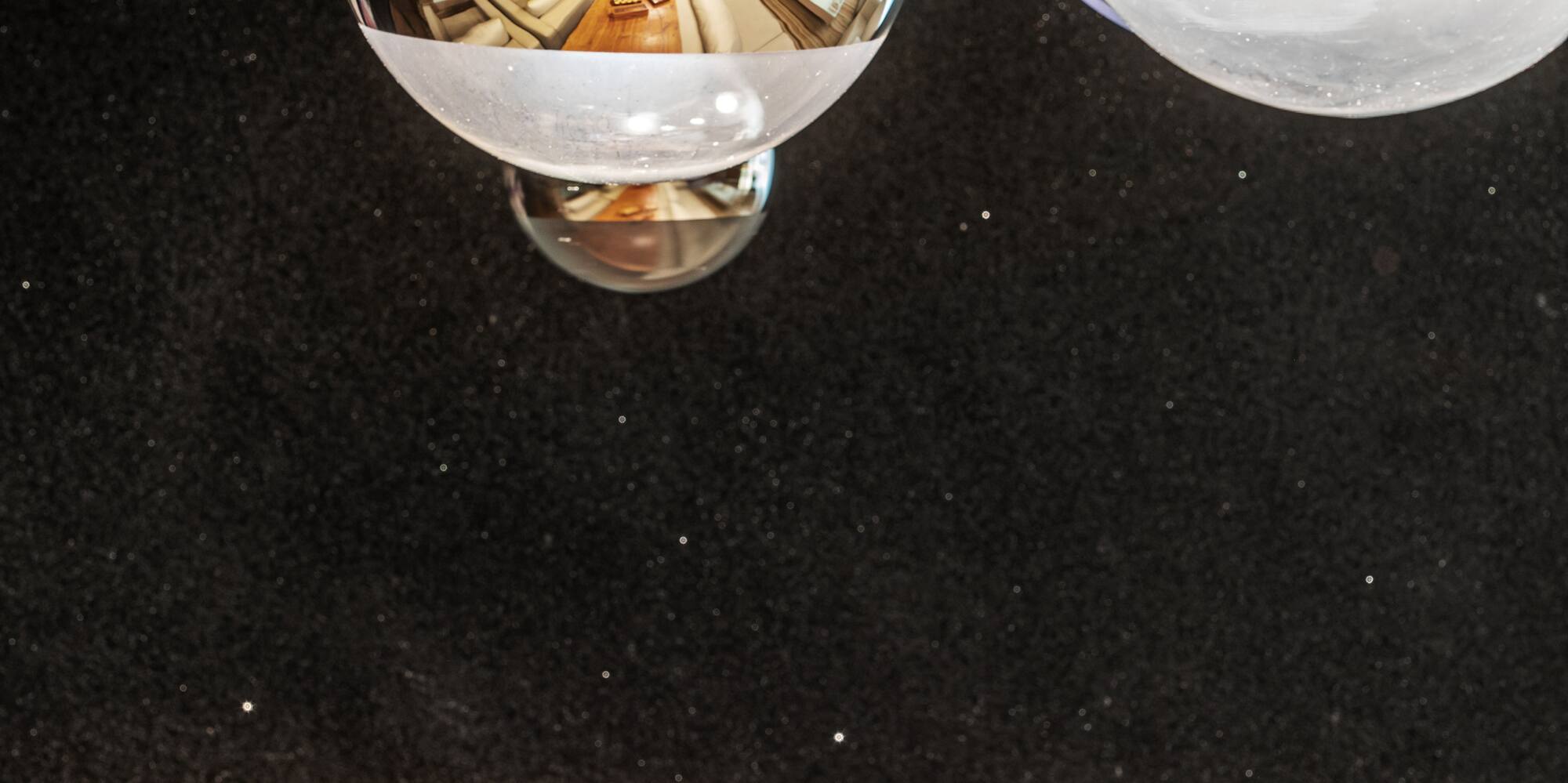 a group of silver balls from a ceiling