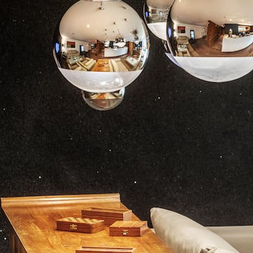 a group of silver balls from a ceiling