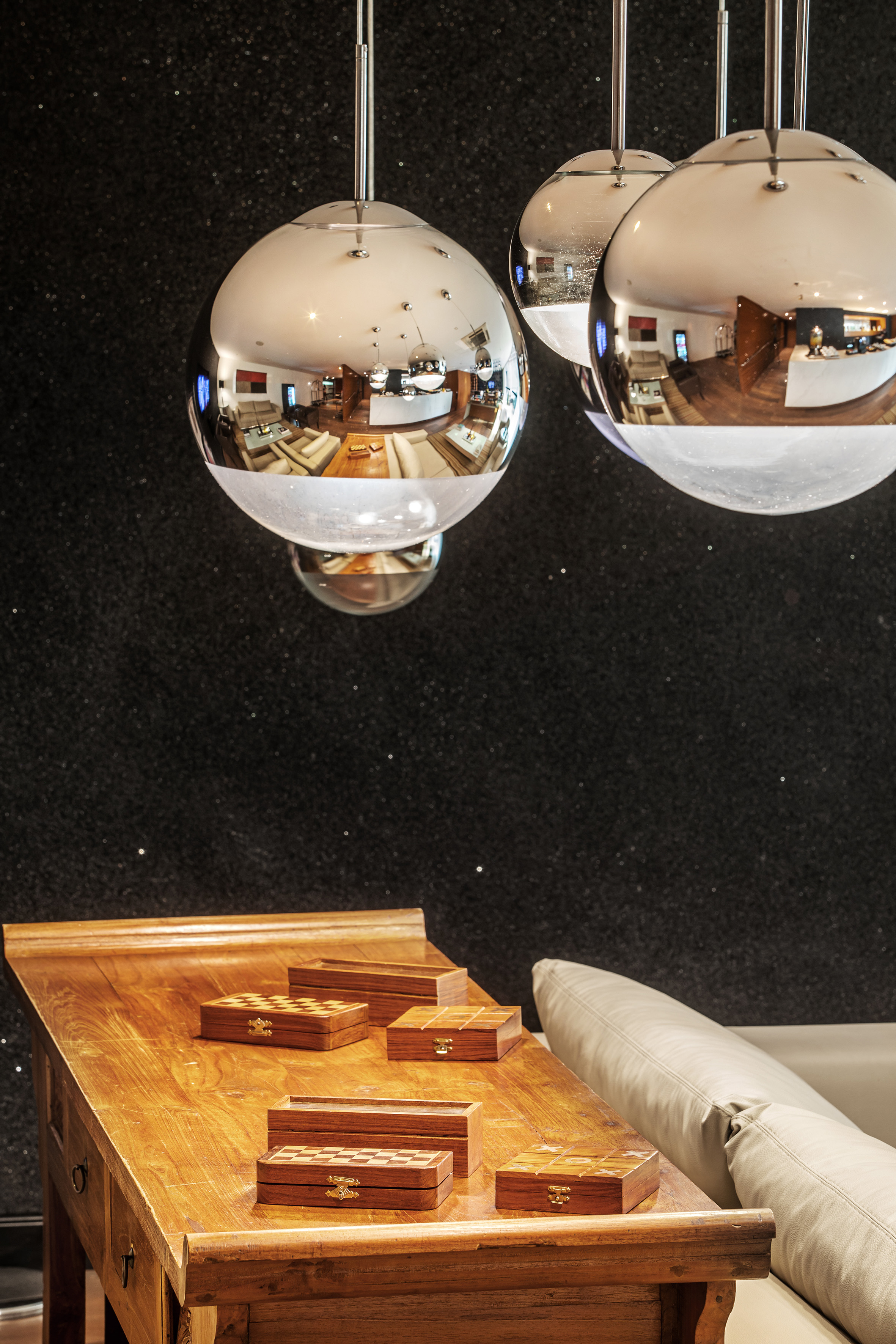 a group of silver balls from a ceiling