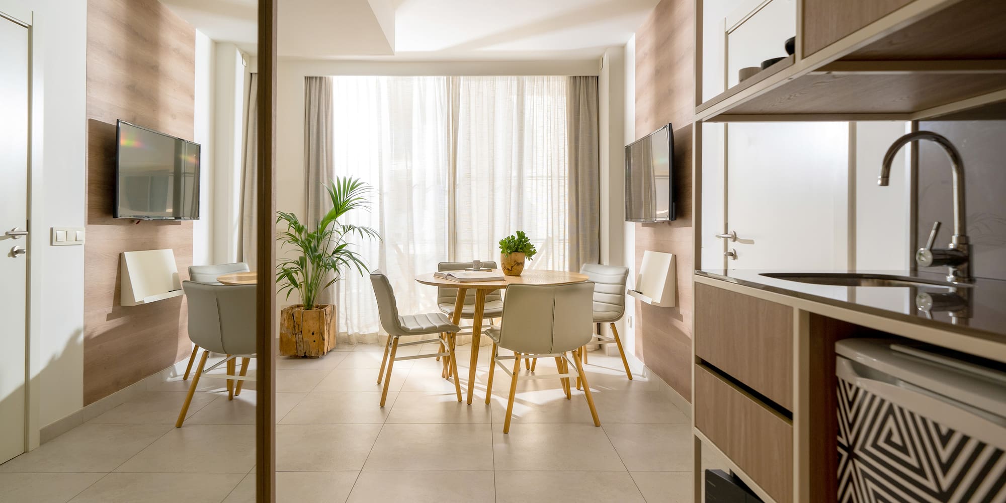 a room with a table and chairs