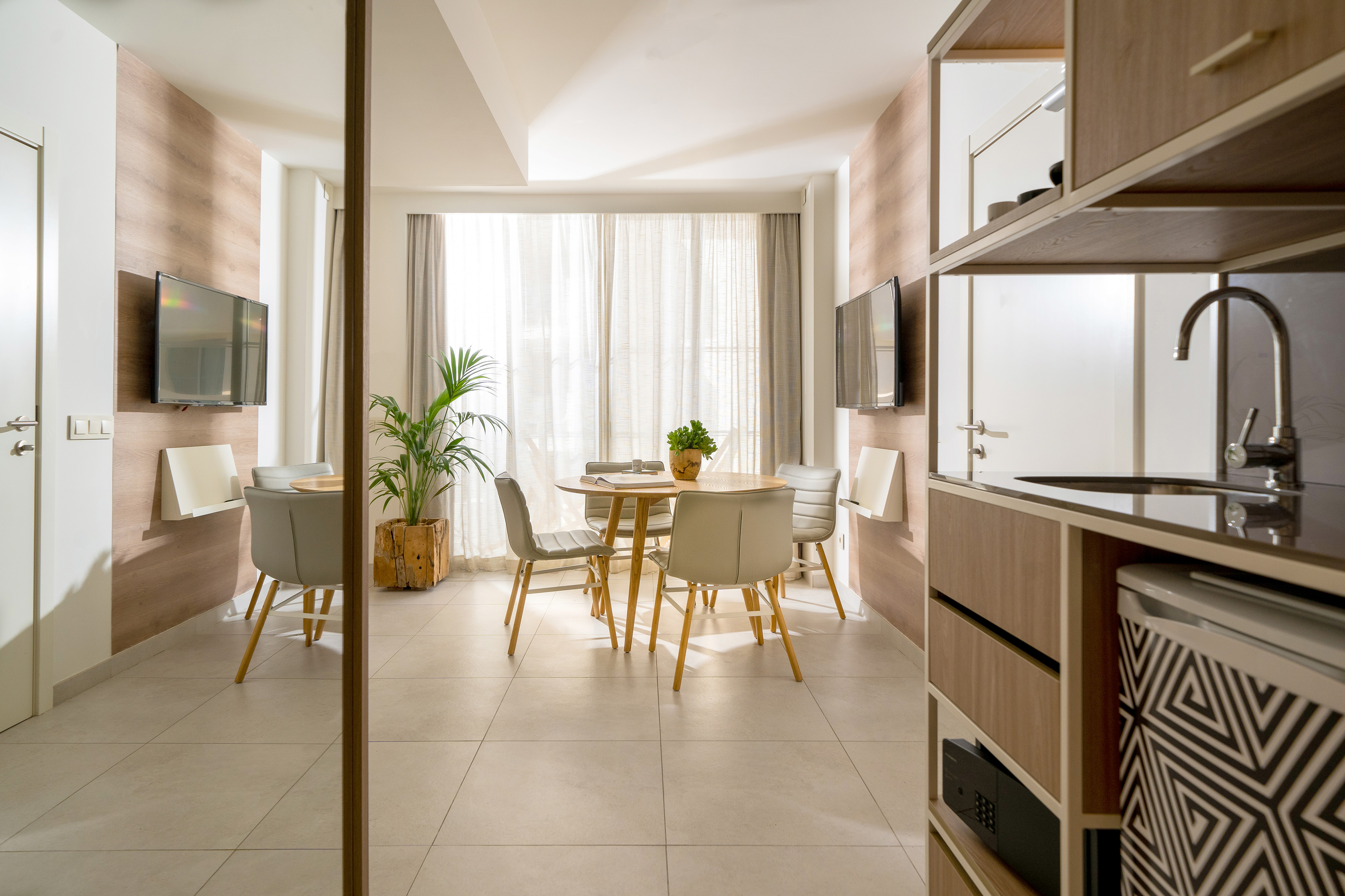 a room with a table and chairs