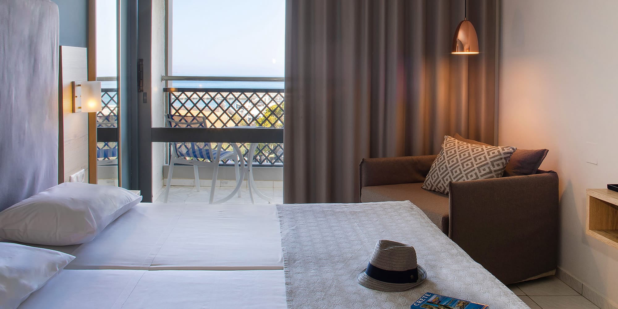 a room with a bed and a chair and a book