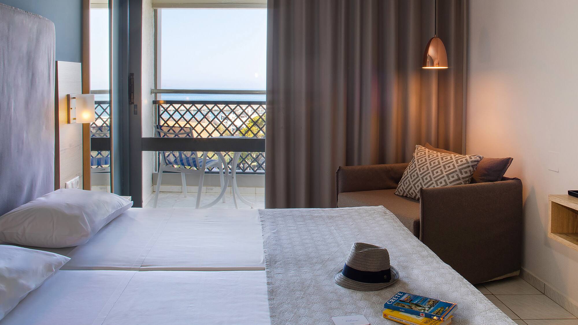 a room with a bed and a chair and a book