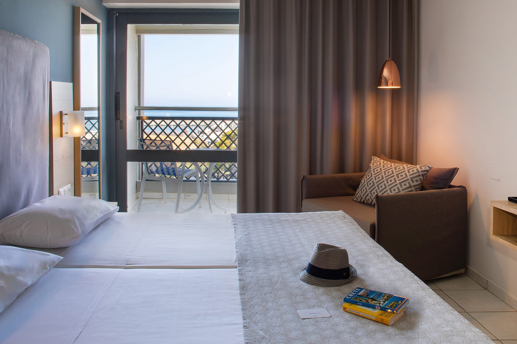 a room with a bed and a chair and a book