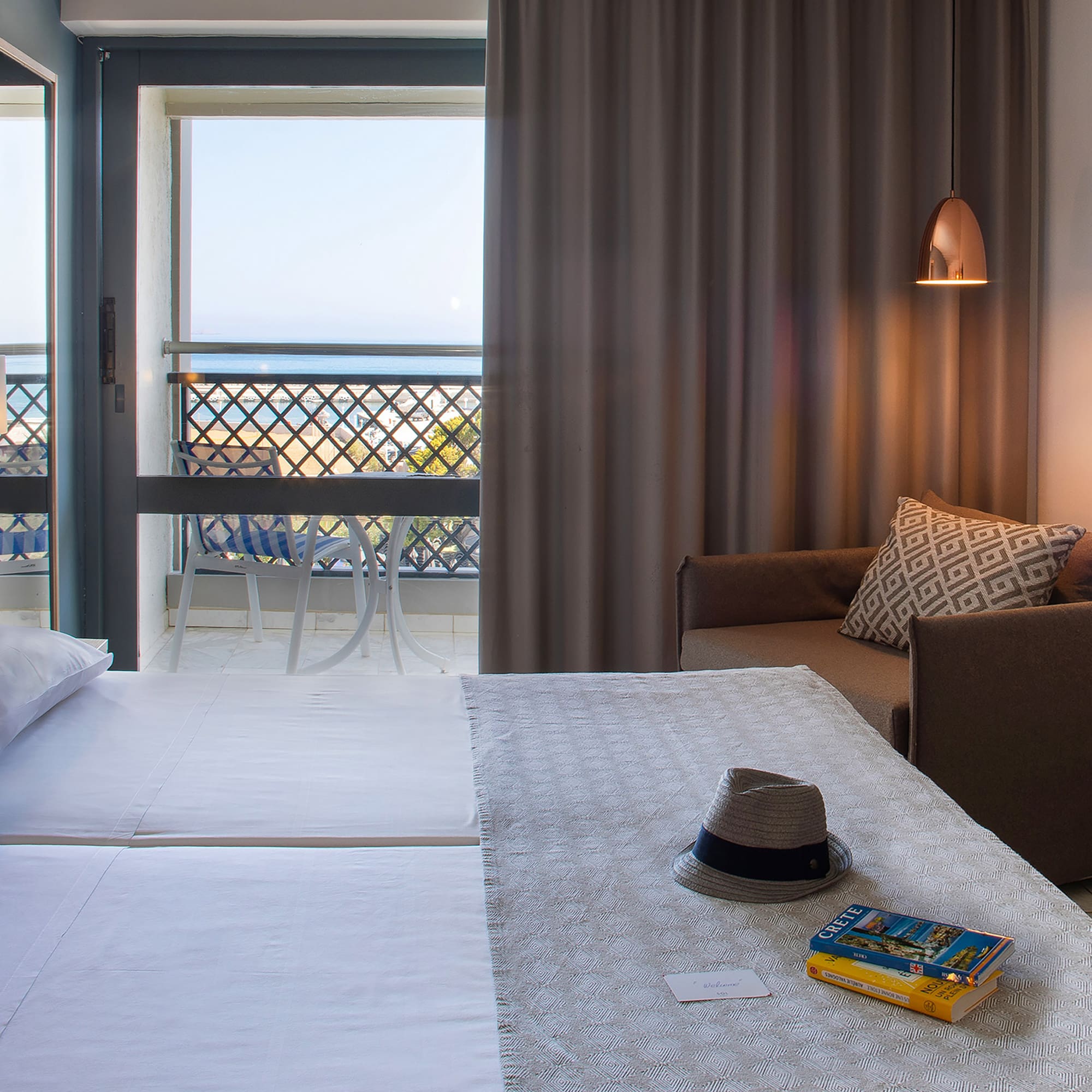 a room with a bed and a chair and a book