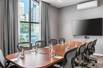 a conference room with a table and chairs