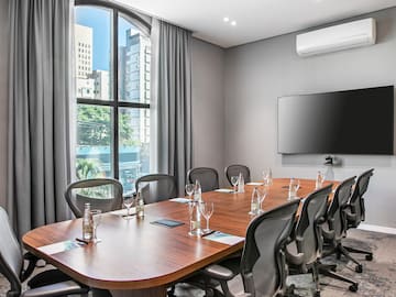 a conference room with a table and chairs
