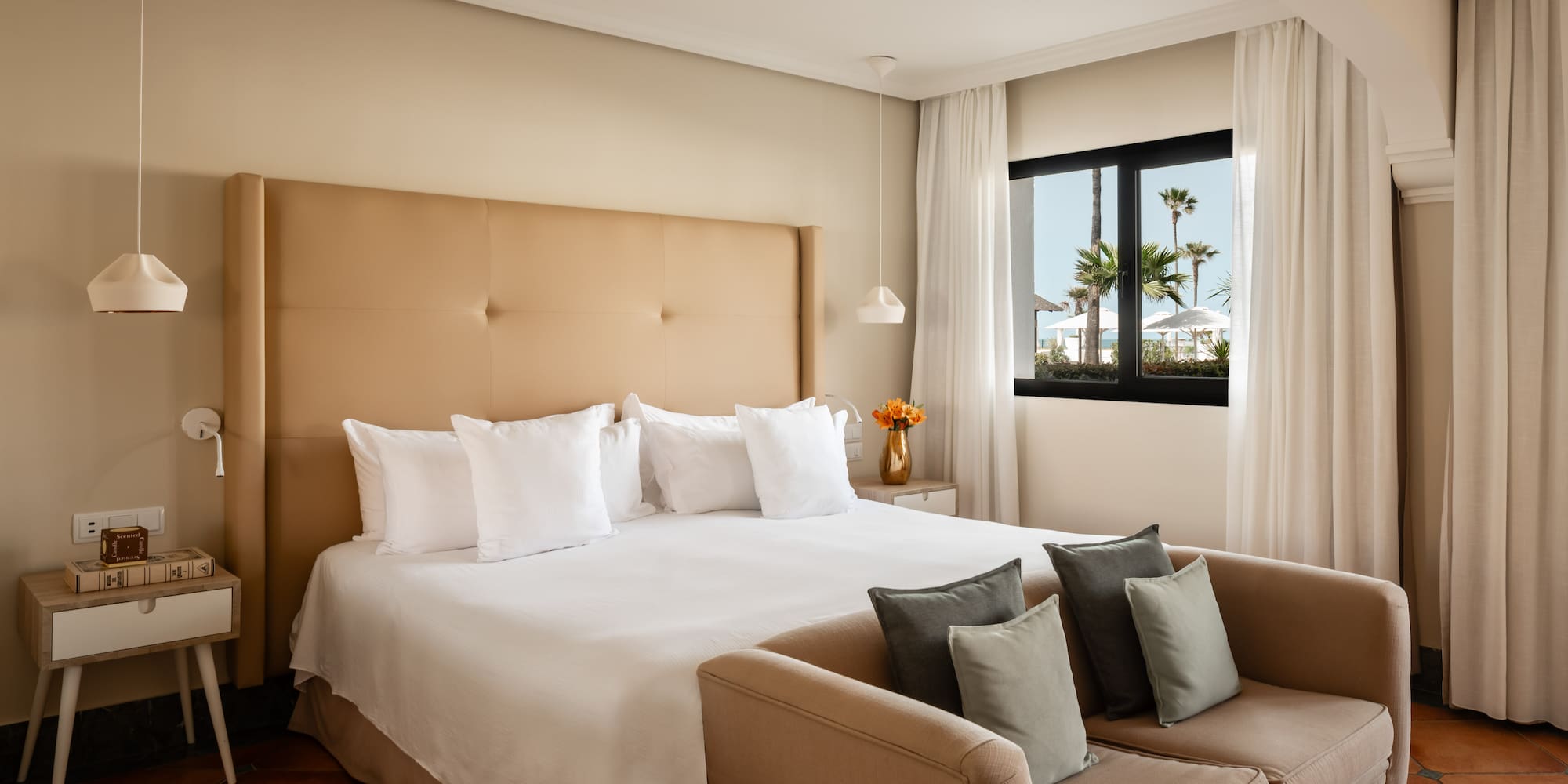 a bed with pillows in a room